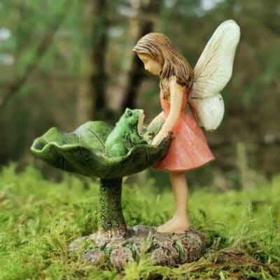 fairy figurine with frog