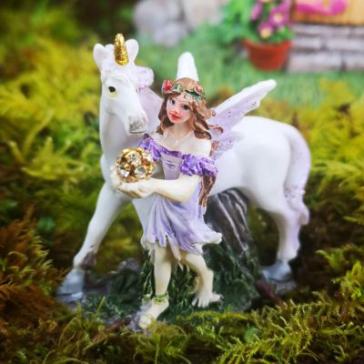 purple unicorn and fairy figurine