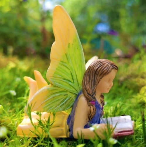 fairy figurine with book