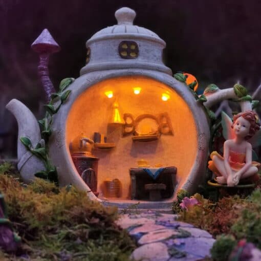 solar teapot fairy house