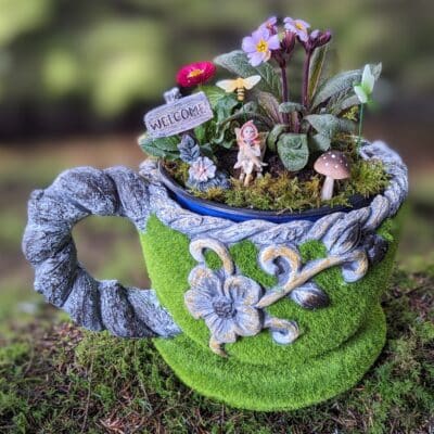 teapot planter with a fairy garden